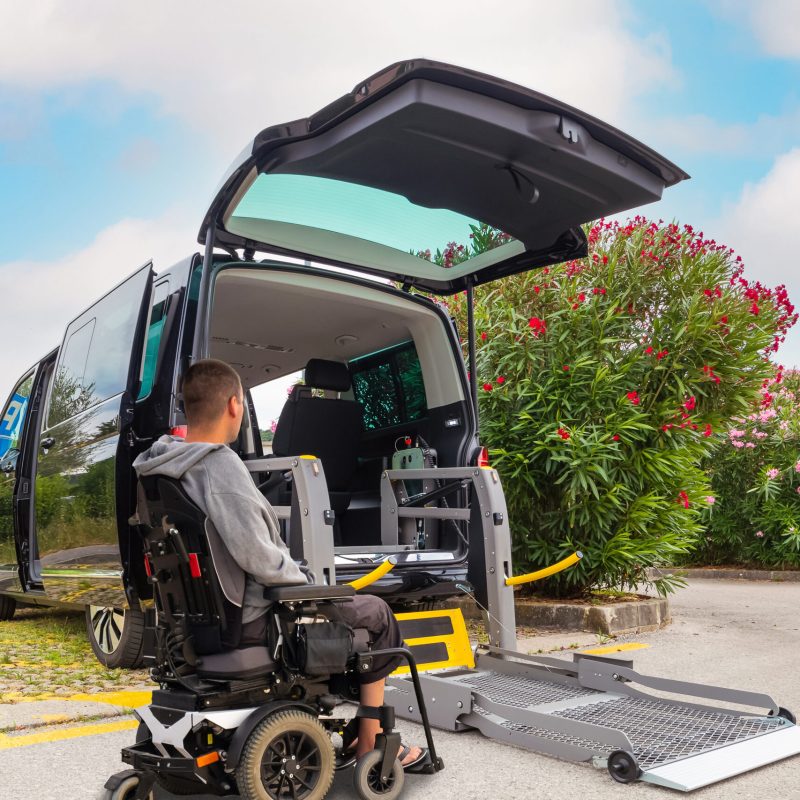 Accessible car with wheelchair lift ramp for person with disability
